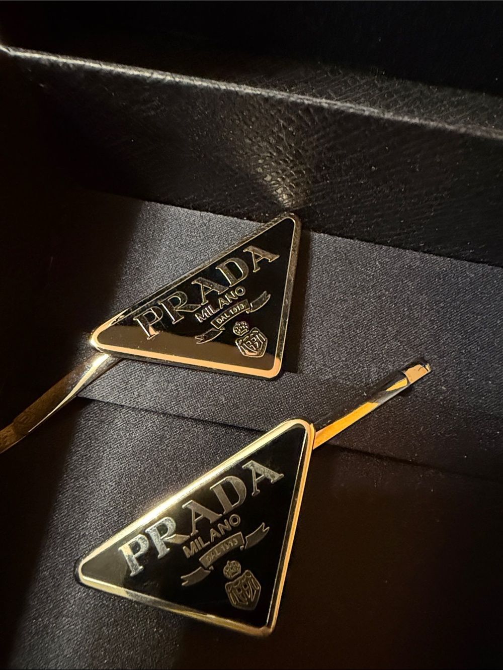 Prada Black and Gold Triangle Logo Hair Clips cozy